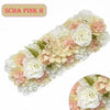 A floral arrangement featuring pink and white artificial silk roses and filler flowers for weddings and events.