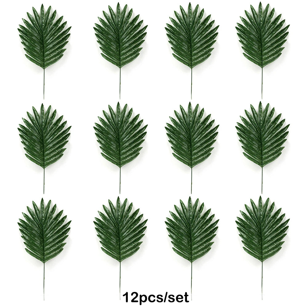 Twelve artificial tropical palm leaves in various shades of green arranged for party decor