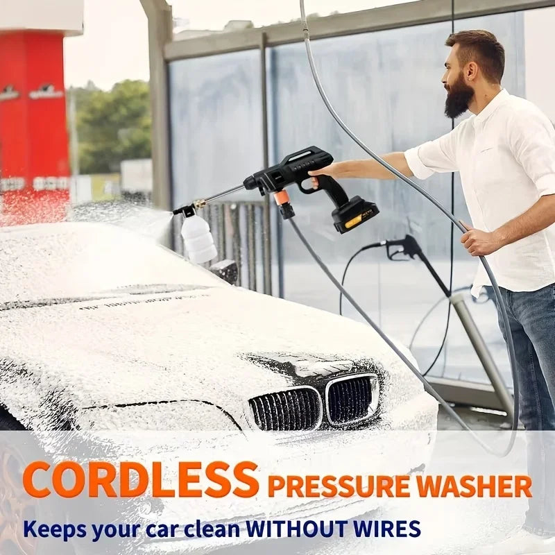 A man is using a cordless pressure washer to clean the front of a white car.