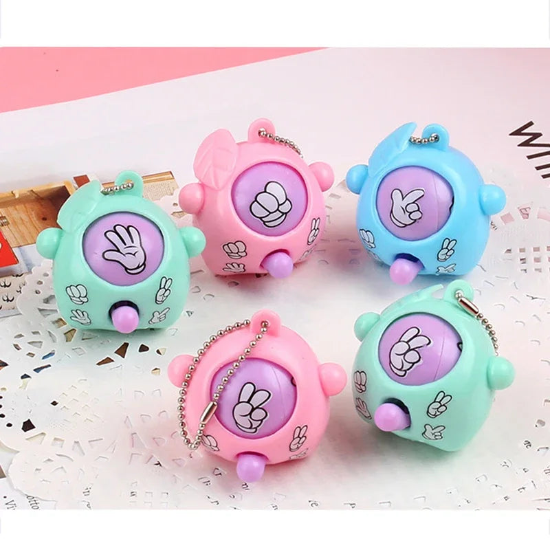 Four pastel colored guessing game eggs in pink, blue, and green are displayed on a white surface.