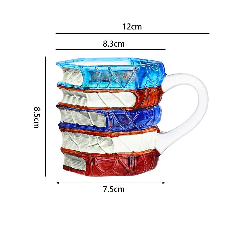 A stack of hand-painted ceramic mugs featuring various book designs in blue, orange, and white.