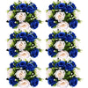 A set of six bouquets featuring blue and cream silk artificial roses arranged in a ball centerpiece style.