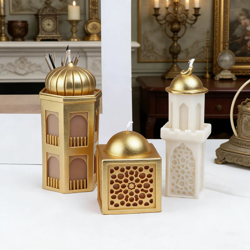 A set of gold and white silicone candle molds shaped like a mosque for Ramadan