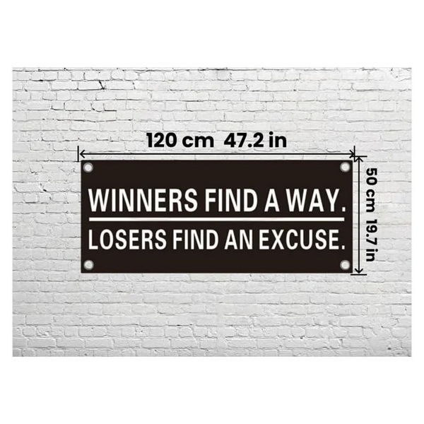 A black motivational wall banner on a white brick wall with dimensions 120 cm by 50 cm.