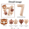 A set of foil balloons shaped like the number 7 and a bear, in caramel and nude colors.