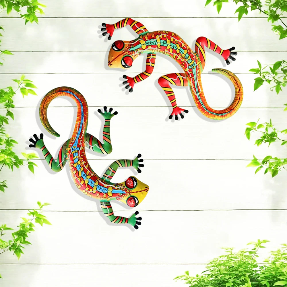 Handcrafted metal gecko wall art featuring colorful, vibrant geckos against a white wooden background.