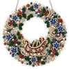 An LED-illuminated diamond painting wreath kit featuring a circular holiday wreath decorated with red, blue, and white elemen