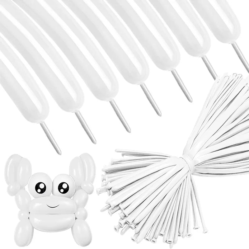 White twisting balloons with a bow and a frog-shaped balloon visible