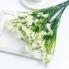 A bouquet of white artificial calla lily flowers on a wooden tray.