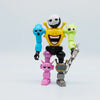 A collection of colorful robot figures, including a white-headed figure, a yellow smiling figure, a green figure, and two sma