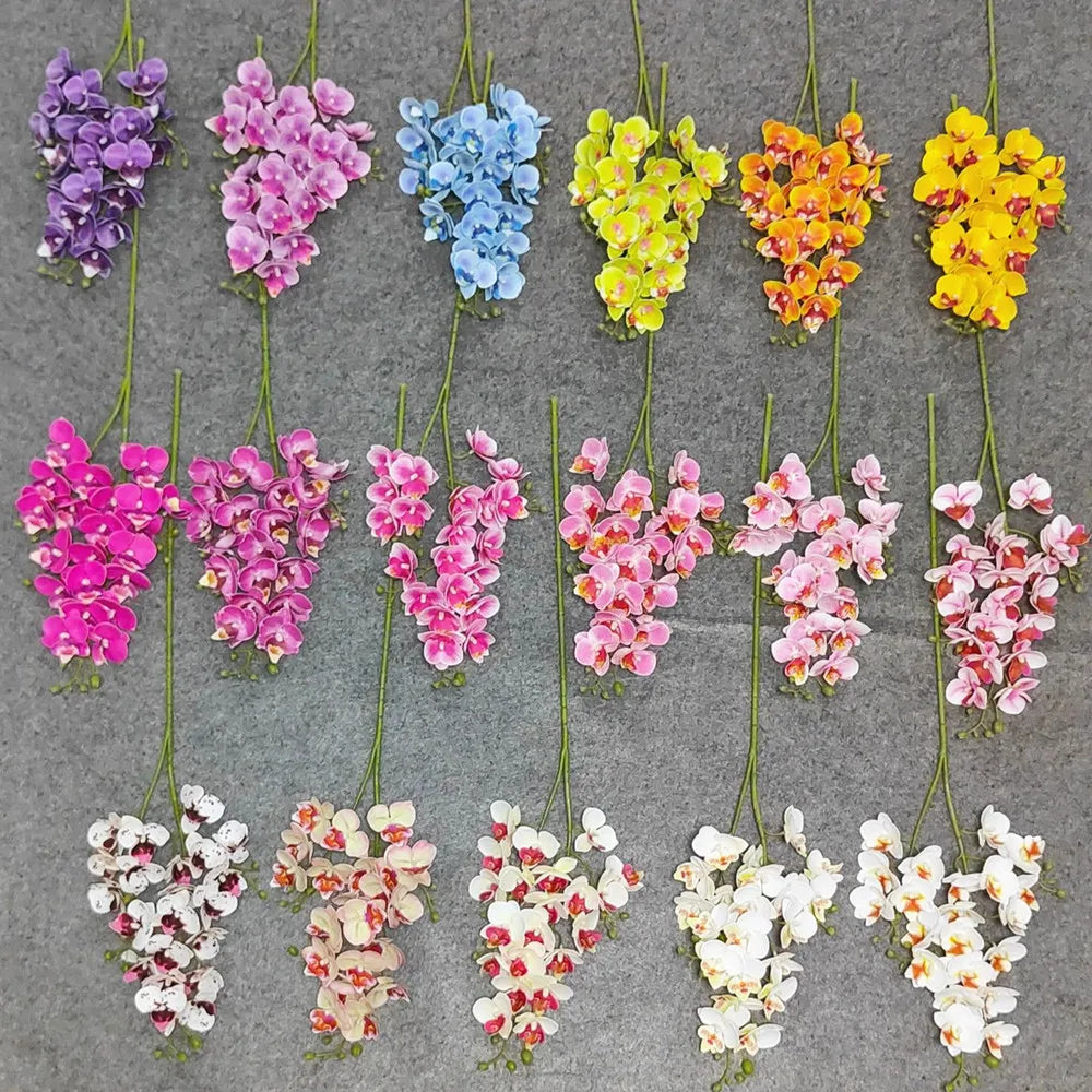 A collection of lifelike butterfly orchid stems featuring various shades of purple, pink, blue, and yellow blooms.