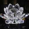 A clear crystal lotus flower ornament with multiple petals displayed on a reflective surface.