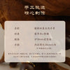 Handcrafted Thunder-Wood Pixiu bracelet with semi-jade beads displayed on a wooden background.