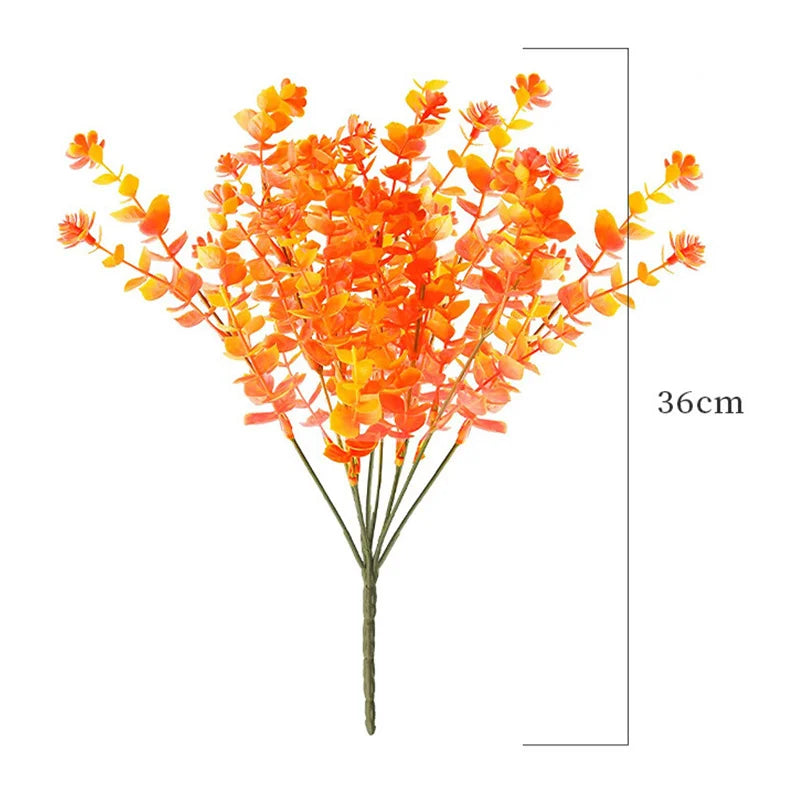 A bouquet of bright orange artificial daisies used for autumn home decor.