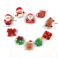 Un juego de lindos imanes navideños de nevera con Santa, renos y diseños festivos.