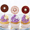 Three cupcakes decorated with purple frosting and colorful sprinkles, featuring round sealing labels.