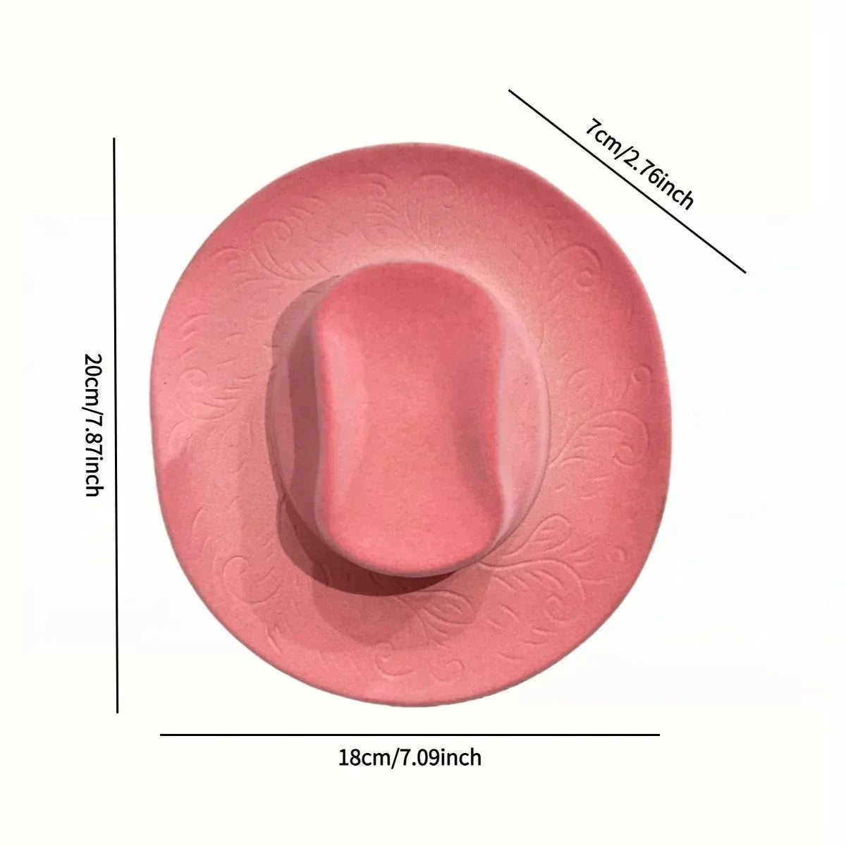 A round, pink resin wall vase holder with a smooth, oval depression and decorative embossed patterns.