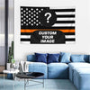 A custom photo American flag tapestry displayed on a wall above a blue sofa.