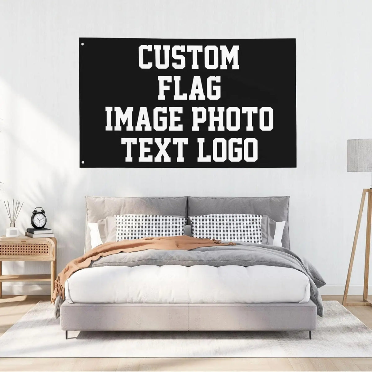 A black sign with white text that reads CUSTOM FLAG IMAGE PHOTO TEXT LOGO displayed above a modern bed.
