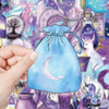 A hand holds a light blue drawstring pouch featuring a silver crescent moon design against a purple and teal background.