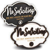 A set of two wooden no soliciting signs with the text No Soliciting Do Not Knock or Ring Bell Thank You