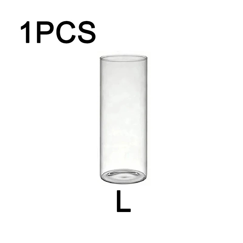 One clear glass candle holder with a cylindrical shape.