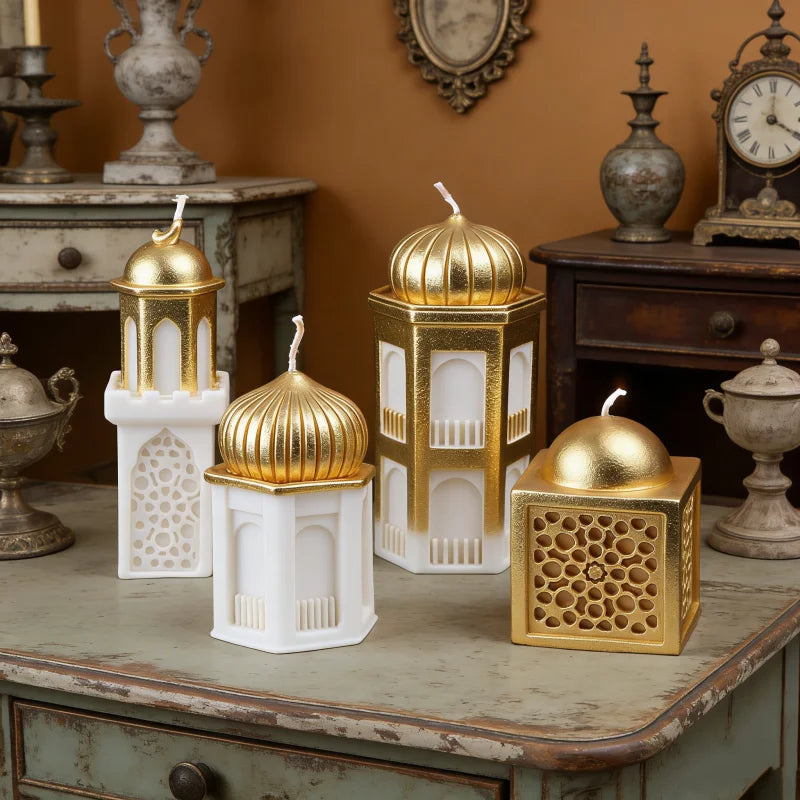 A set of golden and white silicone candle molds shaped like a mosque for Ramadan