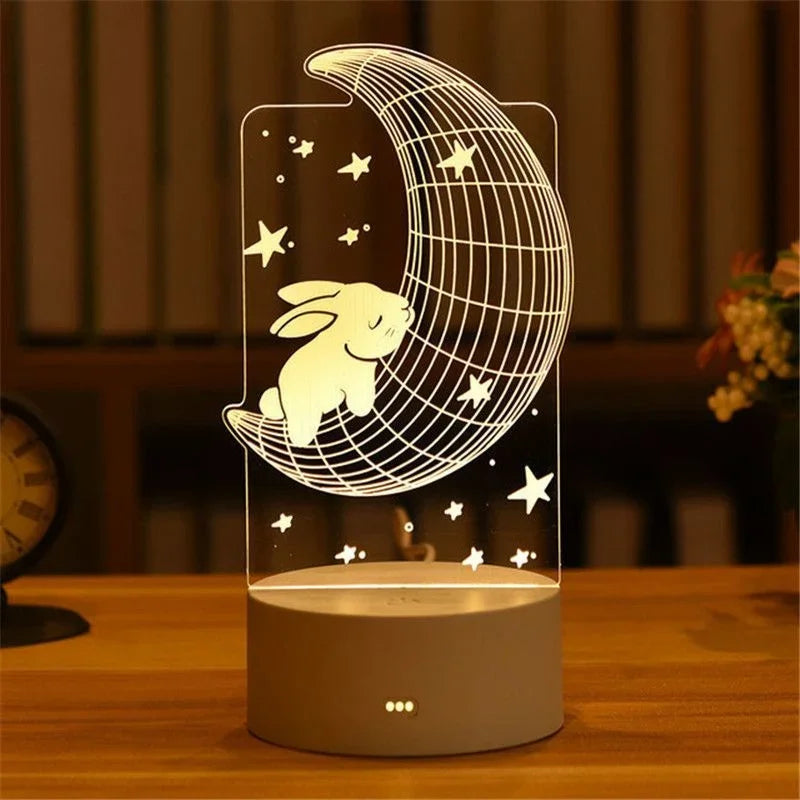 A glowing acrylic night light shaped like a crescent moon with a rabbit silhouette and stars on a wooden surface.
