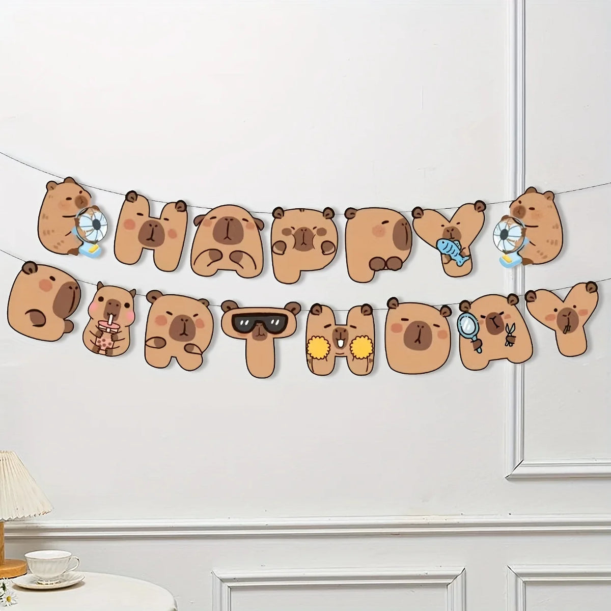 A decorative banner featuring cute brown bear faces and foil balloons for a birthday party theme.