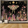 A dark tapestry featuring a large moth, crescent moons, and floral elements in gold and pink tones.