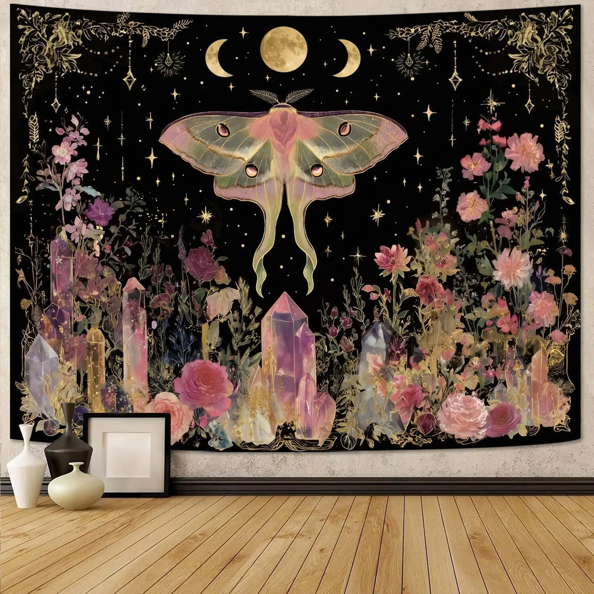 A dark tapestry featuring a large moth, crescent moons, and floral elements in gold and pink tones.