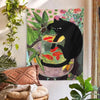 A tapestry featuring a black cat sitting on a goldfish bowl, inspired by Matisse art.