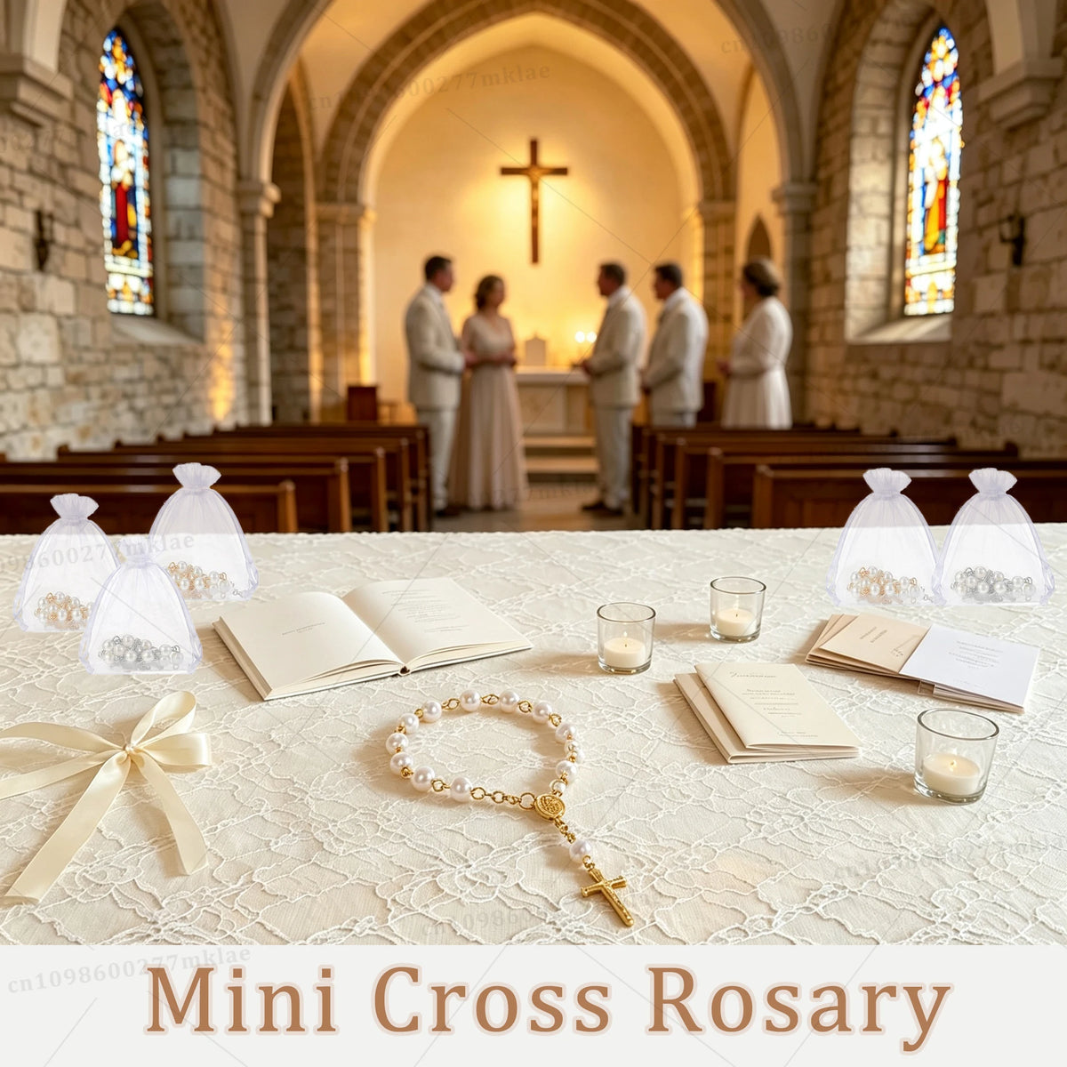 Mini Cross Rosary favors displayed on a white cloth with a ribbon and several small glass vials.