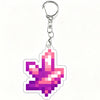 A pink and purple pixel art charm shaped like a maple leaf attached to a silver keychain ring.