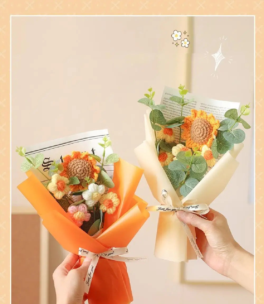 A handmade sunflower daisy crochet bouquet wrapped in orange paper and greenery.