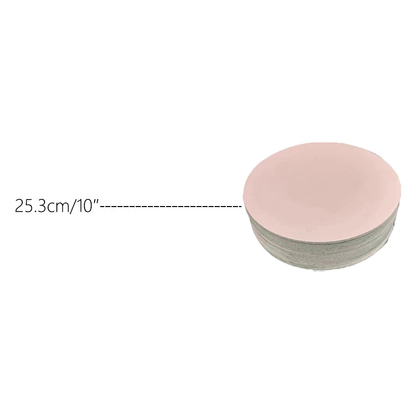 A stack of round pink cardboard cake boards, with a dimension line indicating 25.3cm or 10 inches.