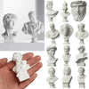 A collection of plaster bust miniatures depicting classical Greek mythology figures.