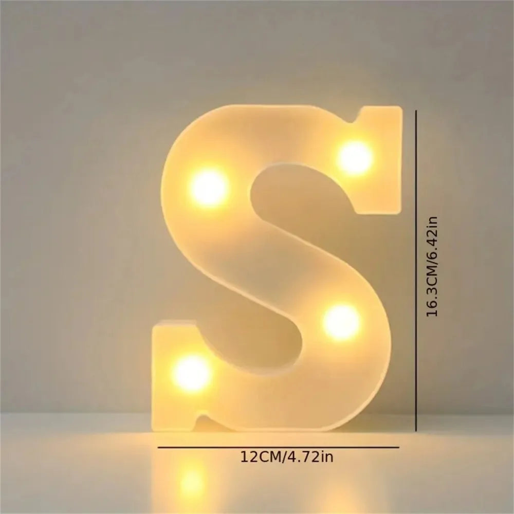A glowing, translucent letter S made of LED lights, used for cozy room or party decor.