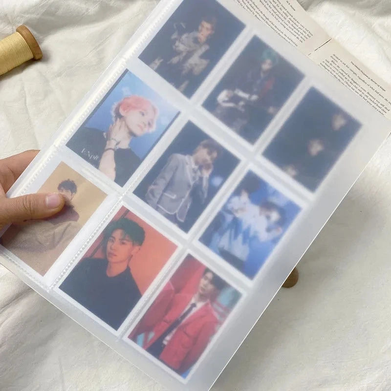 A close-up of a K-Pop photo card binder displaying various idol photos in a grid layout.