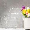 A clear heart-shaped acrylic keepsake with engraved text and a bouquet of tulips.