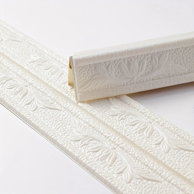 White self-adhesive foam wall trim strips with embossed leaf patterns.