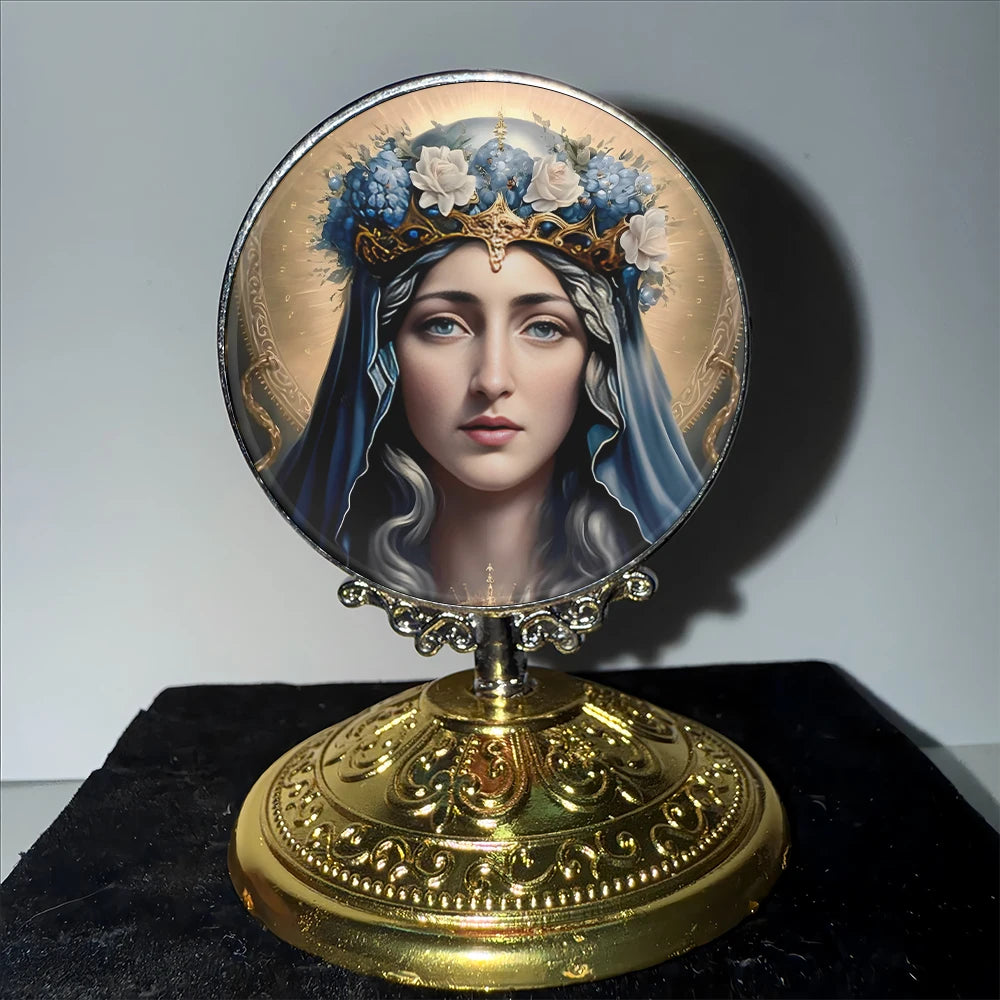 A round silver-framed ornament featuring a portrait of the Virgin Mary wearing a crown of blue flowers.