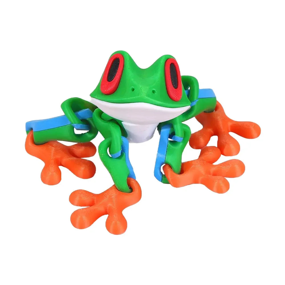 A colorful, movable 3D printed tree frog ornament with green and red features.