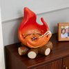 An anime-inspired orange fire spirit resin key tray and desk organizer resting on a dark wooden surface.