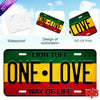A green and yellow Lion Tuff sign with the text ONE LOVE WAY OF LIFE on a red background.