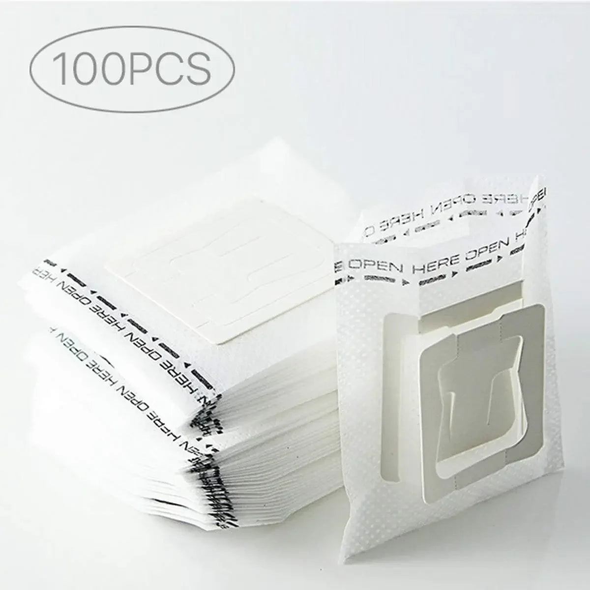A stack of 100 disposable hanging ear coffee filter bags for pour-over brewing