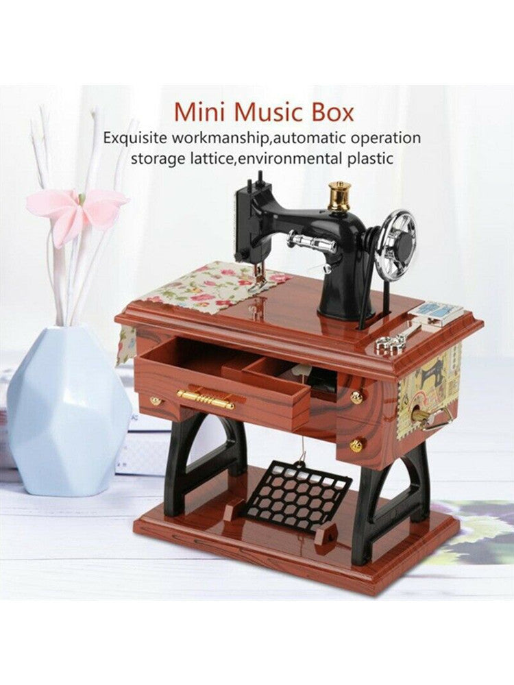 A brown wooden mini music box featuring a vintage sewing machine and storage lattice.