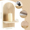 A tall cylindrical candle holder made of light wood with a slotted design, featuring a hanging loop and smooth surface.