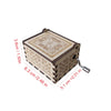 Antique carved wooden music box with a light brown finish and intricate geometric patterns.