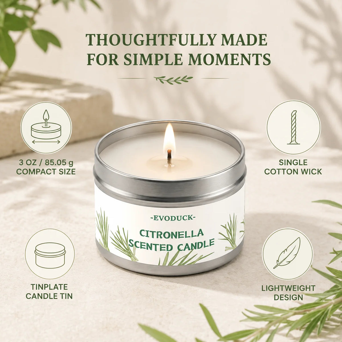A silver tin candle labeled Citronella Scented Candle with lemongrass leaves on a light background.